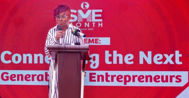 An image of a lady on a podium at the launch of the 8th edition of the Telecel Ghana SME Month