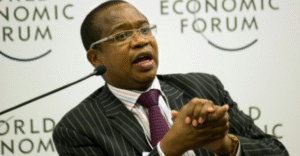 A picture of Mthuli Ncube, who is the finance minister for Zimbabwe holding a microphone and speaking at an economic forum.