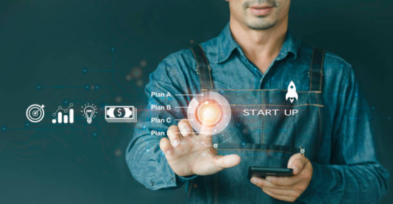A stock photo of a businessman pressing a button on virtual screens. It includes Start-up Funding Crowdfunding Investment Venture Capital Entrepreneurship business, technology, internet, and networking concept.